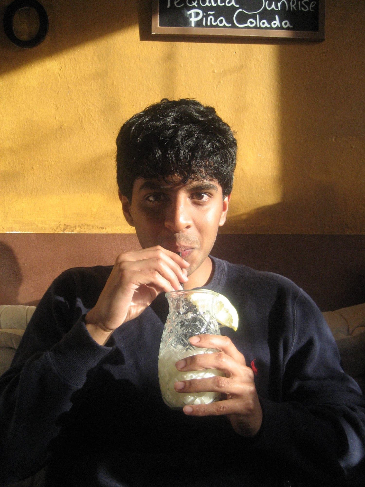Tejas holding a drink